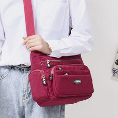 Bolso bandolera de nailon impermeable con múltiples bolsillos